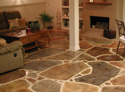 Decorative concrete interior floor stained in multiple colors and shapes.
