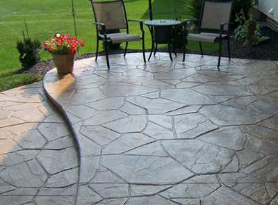 Multi-shaped sand stone style stamped concrete patio.