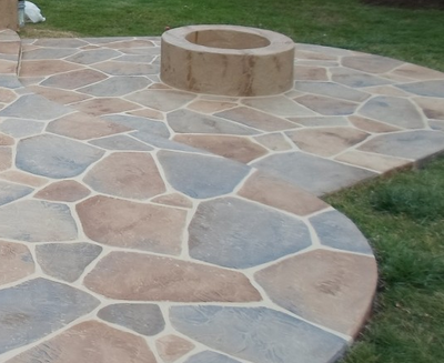 Multi-colored grays and browns sand stone shaped  decorative concrete patio.