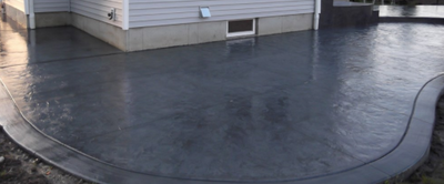 Dark gray stained and polished concrete.
