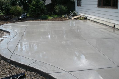 Polished concrete with a stamped concrete edging.